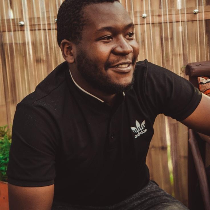 Alex Rivera, Lead Design Curator at Lodge Field Paper, reviewing corporate floral arrangements